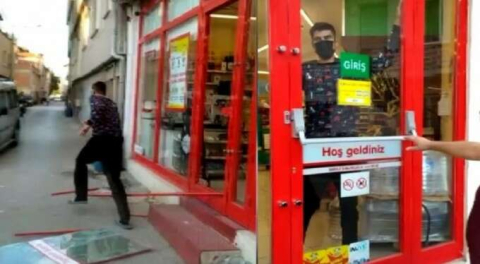 Bursa'da markete kilitlenen hırsız camı kırarak böyle kaçtı