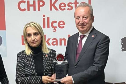 Doğan’dan Asa’ya plaket