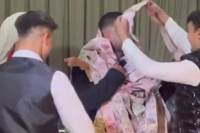 Bursa’da damadı paraya boğdular