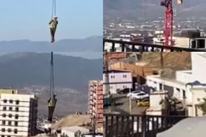 Şantiyede tehlikeli iniş: Vinçle aşağı sarktı