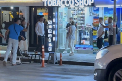 Caddede 'Kafanı keserim' diyerek tehdit etti