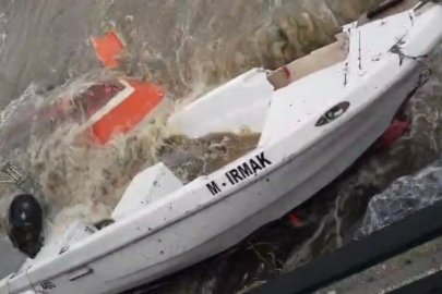 Bursa'da lodosun batırdığı tekneler denizden çıkarılıyor